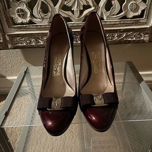 Ferragamo burgundy patent leather wedge pumps